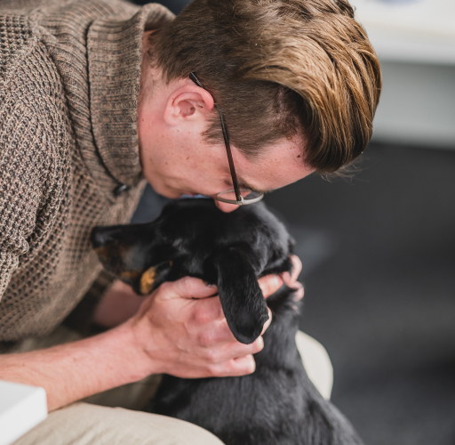 Man hugging the dog