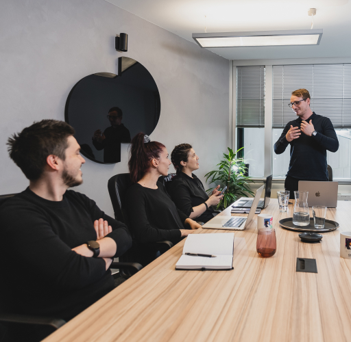 People talking at the meeting table